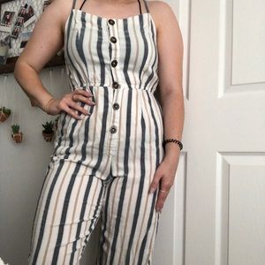 Striped jumpsuit with buttons and pockets